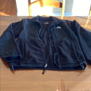 The North Face Women’s jacket. There is some wear on sleeves.